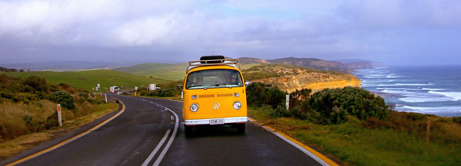 A yellow Kombi on the Great Ocean Road