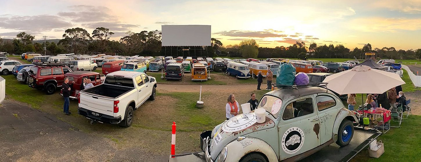 Drive-in at sunset with Kombis parked in rows